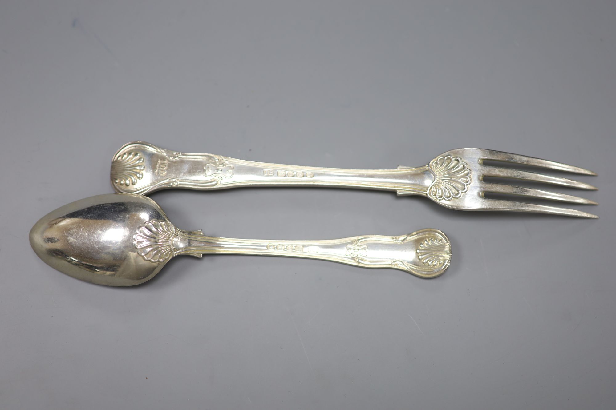 A pair of George IV silver hourglass pattern table forks and pair of dessert spoons and a pair of sugar tongs, 12.7oz